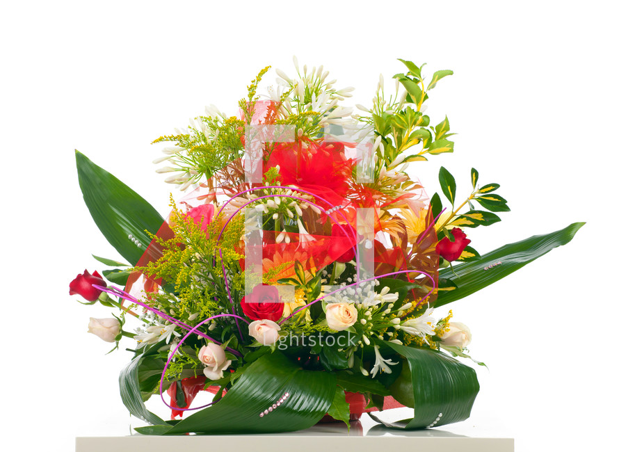 Basket of various flowers on white background