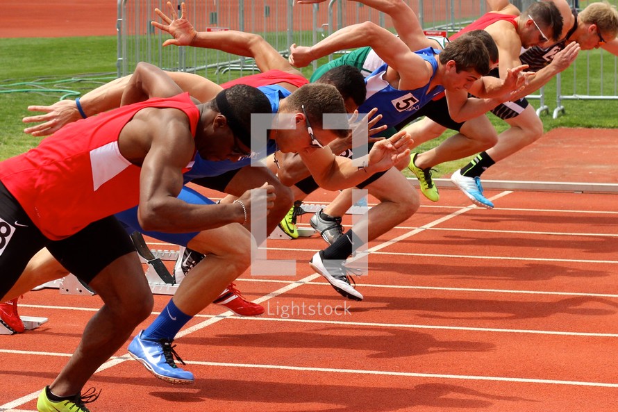 athletes racing on a track 