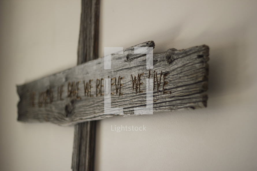 Wooden cross on a wall.