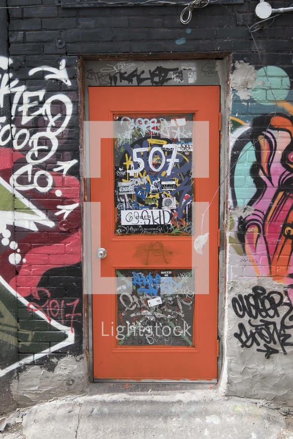 graffiti around a door 
