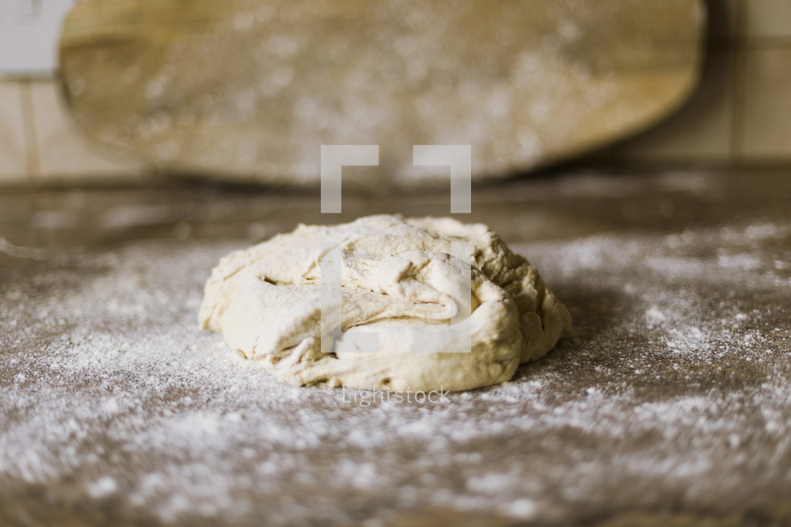 Raw dough on flour