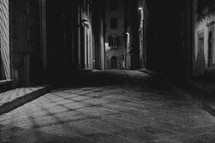 dark narrow empty streets at night in Italy