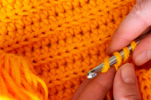knitting orange yarn 