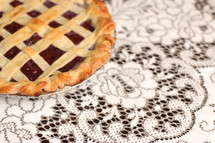 cherry pie on white lace 