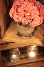 pink carnations in a wooden crate 