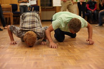 young men having a pushup competition 