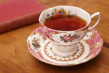 tea cup and saucer and book 