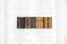 word faith on the pages of a Bible 