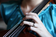a woman playing a cello 
