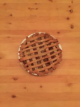 A fruit pie on a wooden table.