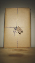 wrapped present in brown paper 