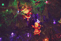 Mr and Mrs Santa Claus ornaments on a Christmas tree
