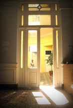 A doorway with light streaming through it