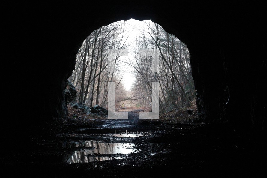 sunlight at the mouth of a tunnel 