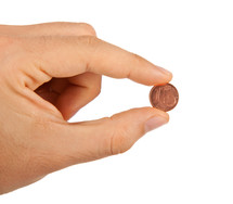 1 euro cent between the fingers on white background