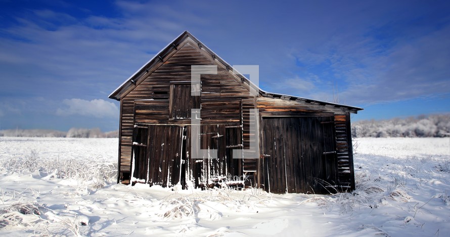 old barn and snow covered ground
