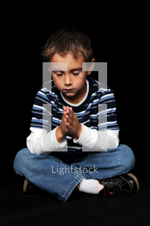 boy child with praying hands 