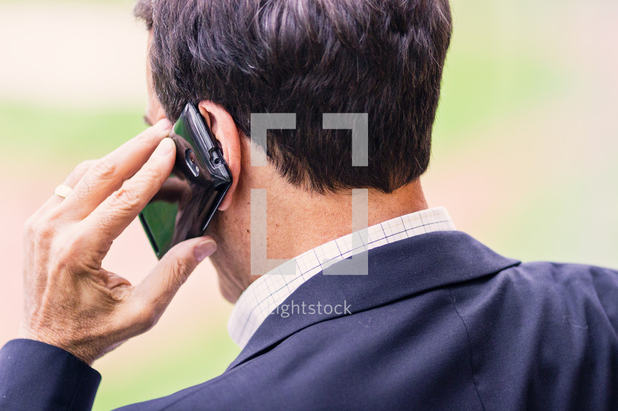 a businessman talking on a cellphone 