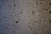 divots in a concrete wall