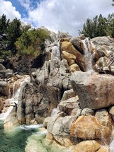 waterfall over boulders 