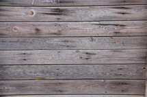 Old wooden planks along the floor of a timber clad house
