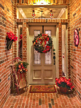 festive front door of a home decorated for Christmas 