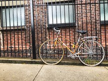 bike locked to a fence 