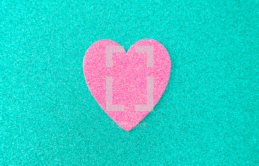 pink heart on teal 