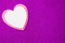 white and pink heart cutouts on purple 