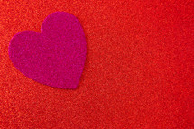 fuchsia heart cutout on red 