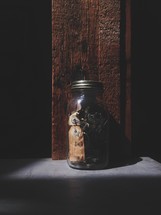 keys and trinkets in a mason jar