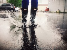 splashing in a puddle wearing galoshes 