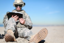 Soldier reading Bible