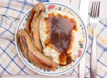 British Classic of Bangers and Mash on a White Background