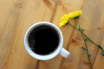 coffee mug and dandelions 