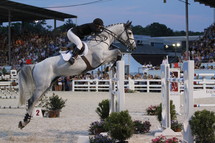horse jumping in an equestrian show 