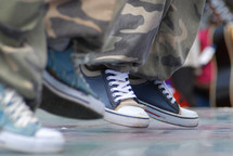 sneakers and camouflage pants 