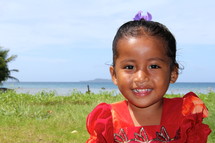 Smiling face of a young Micronesian girl 
