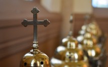 brass cross on candlesticks 