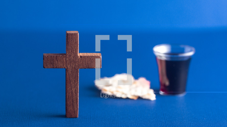 cross and communion elements on blue 