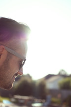 profile of a man in sunglasses 