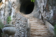 stairs leading up to a tunnel