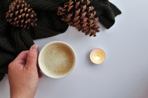 pine cones, latte, and knit scarf 