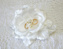 white rose with wedding bands 