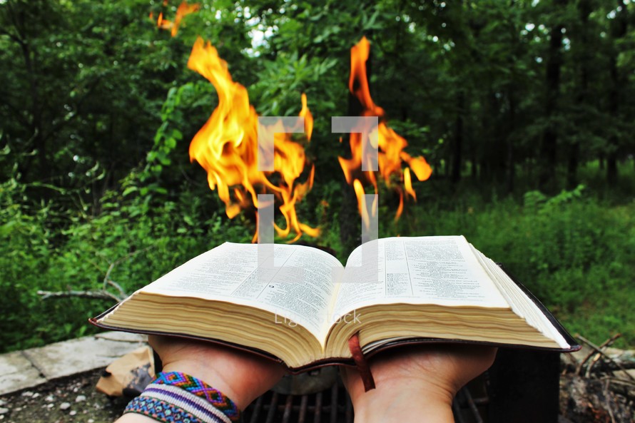 flames from the pages of a Bible 