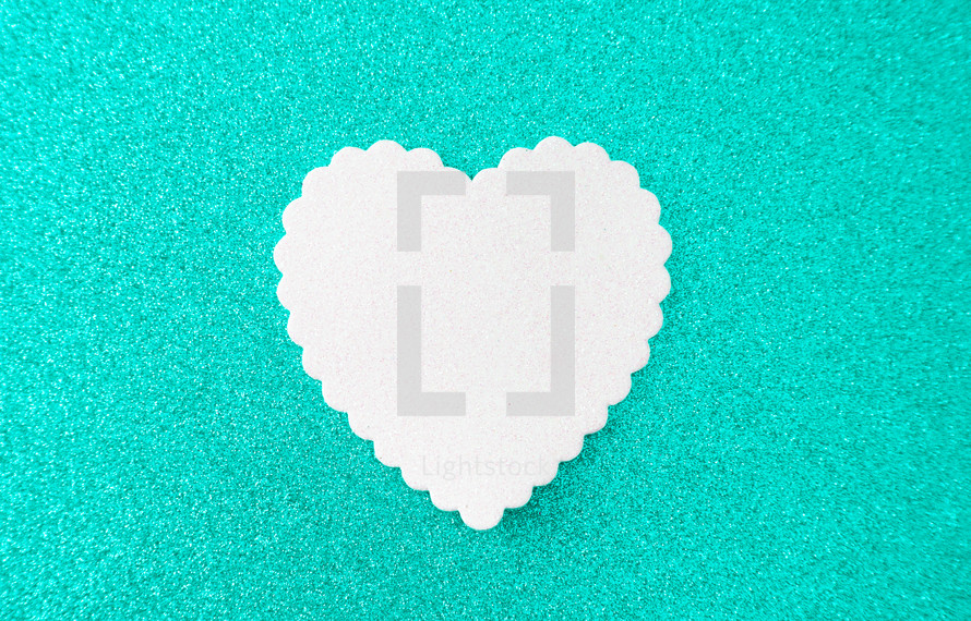 white heart on teal 