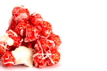 Candy Cane White Chocolate Drizzled Red Popcorn on a White Background