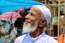 Elderly Muslim man with skull cap and grey beard [For similar, try search Ethnic Face]