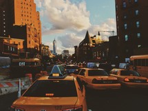Taxi cabs in heavy city traffic.