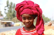 Young girl wearing a traditional head scarf 